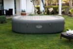 Bestway® Lay-Z-SPA® XXL-Whirlpool Mauritius AirJet™ mit App-Steuerung, für 7 Personen Ø 270 x 180 x 71 cm, Holz-Optik (Basaltgrau)